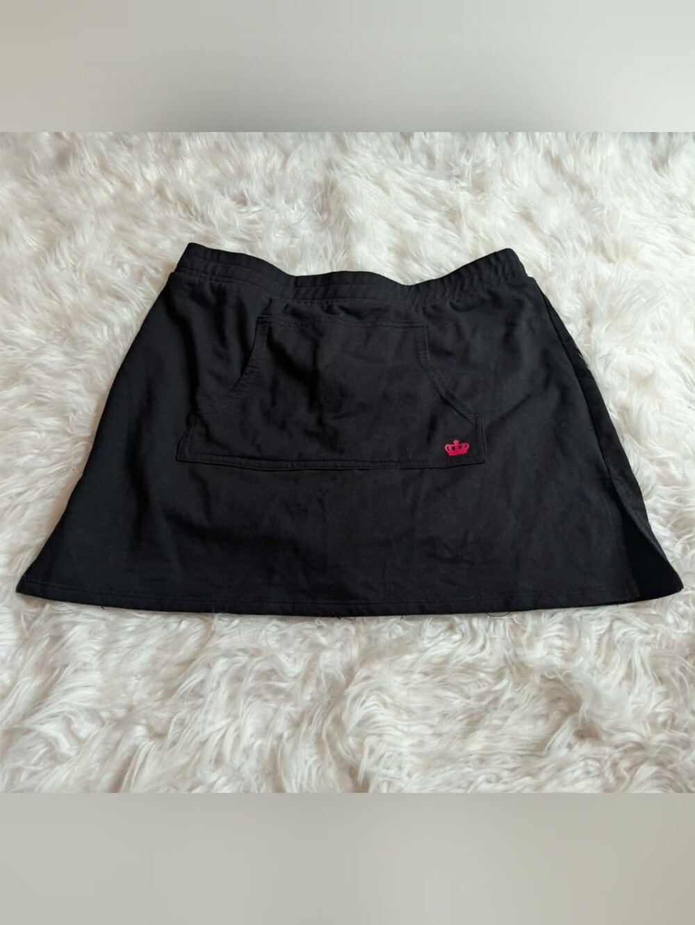 Nwot black Juicy Couture skort features a small pink embroidered crown logo